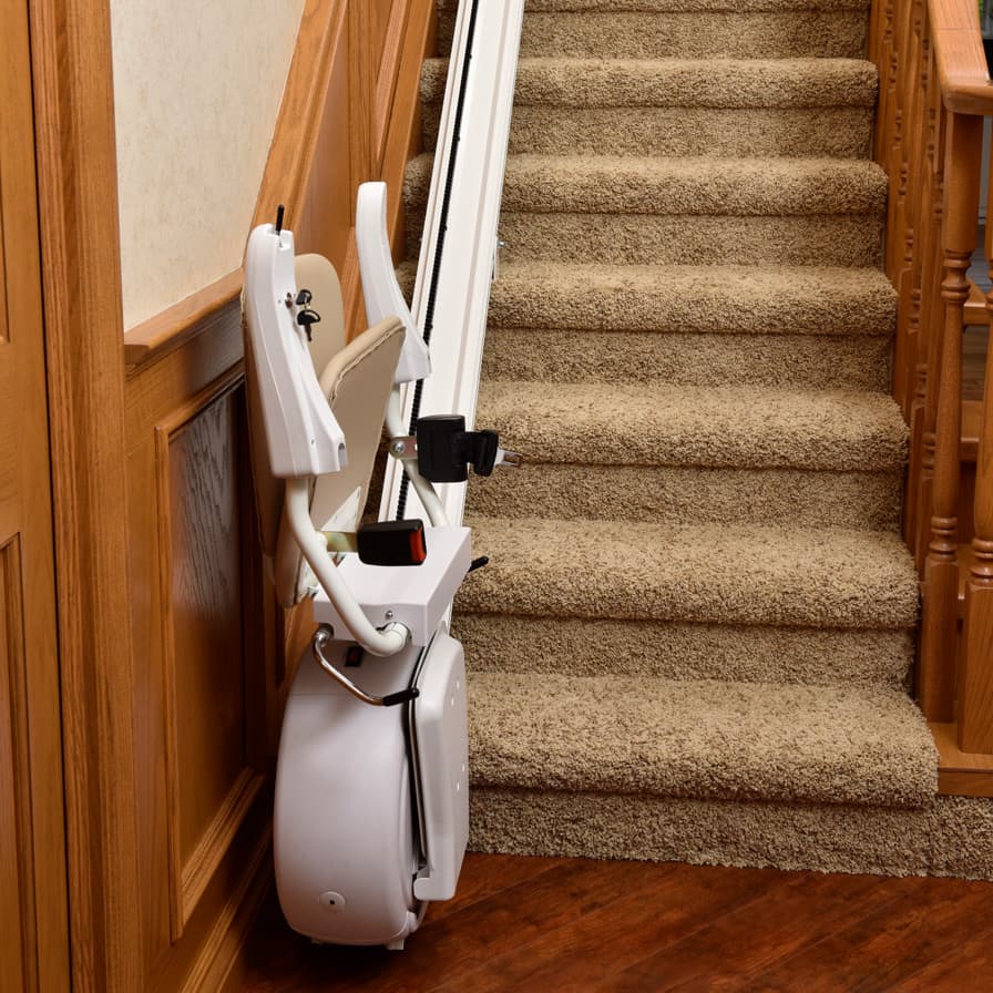 Savaria K2 Straight Stairlift Folded Up Bottom of Stairs