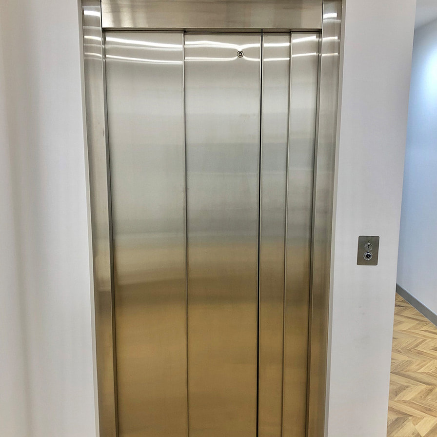 Savaria Eclipse Commercial Lift with Closed Stainless Steel Doors